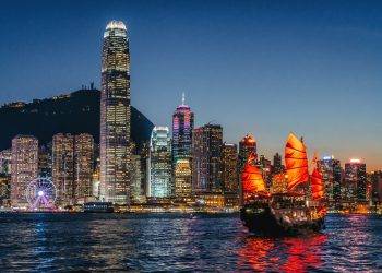 cityscape hong kong and junkboat at twilight