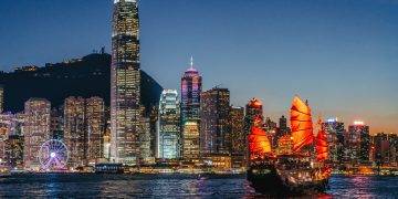 cityscape hong kong and junkboat at twilight