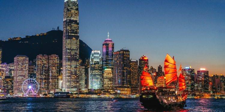 cityscape hong kong and junkboat at twilight